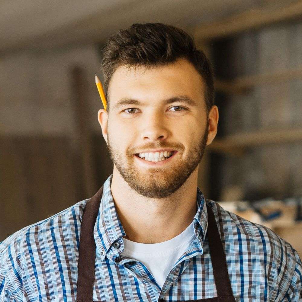 Portrait of a smiling young male carpenter